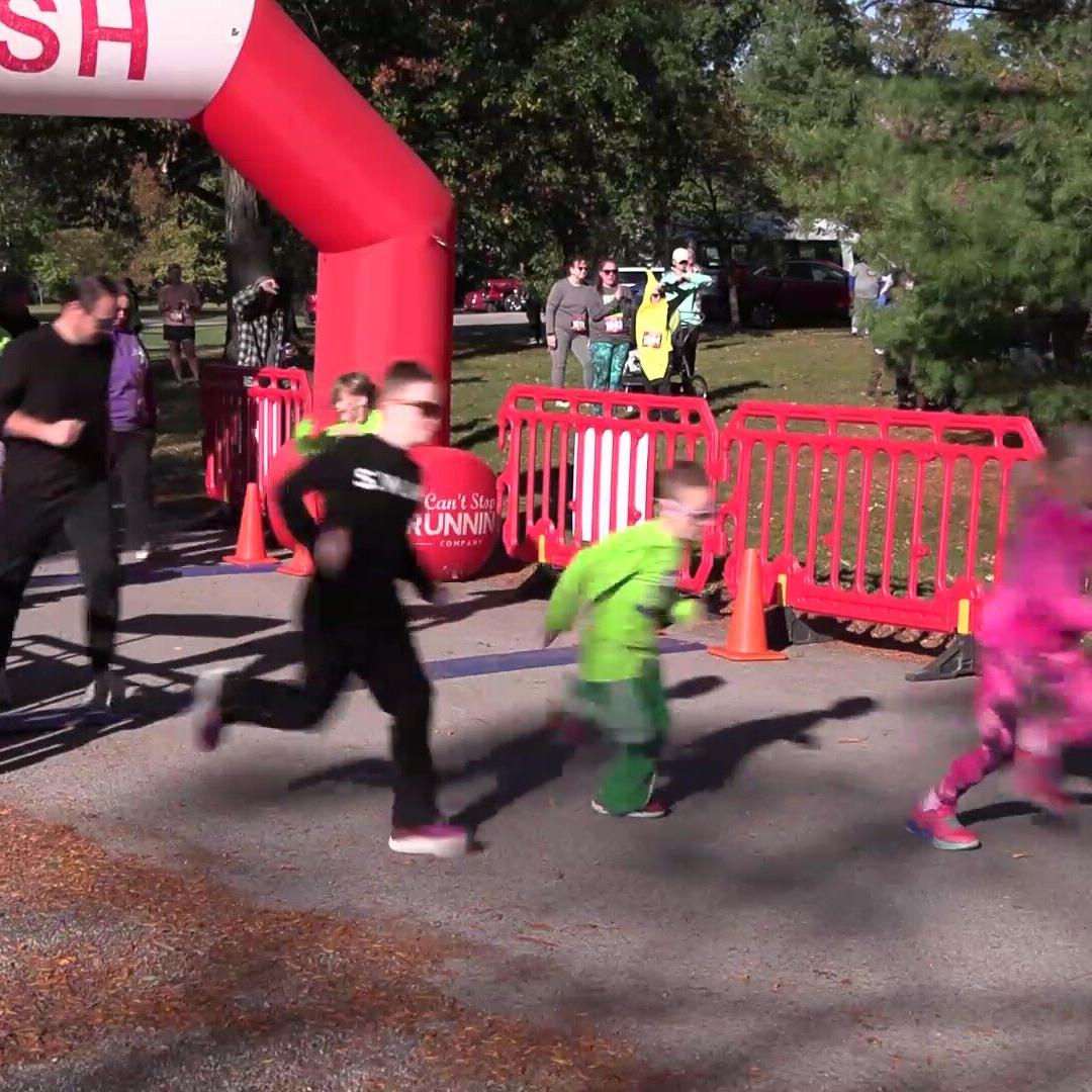 Runners race through Woodlawn Cemetery for Kiwanis Club’s Howl’oween Trick or Trot